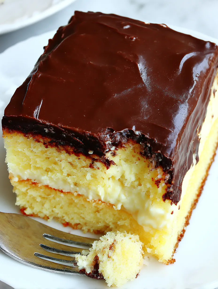 A piece of cake with chocolate frosting.