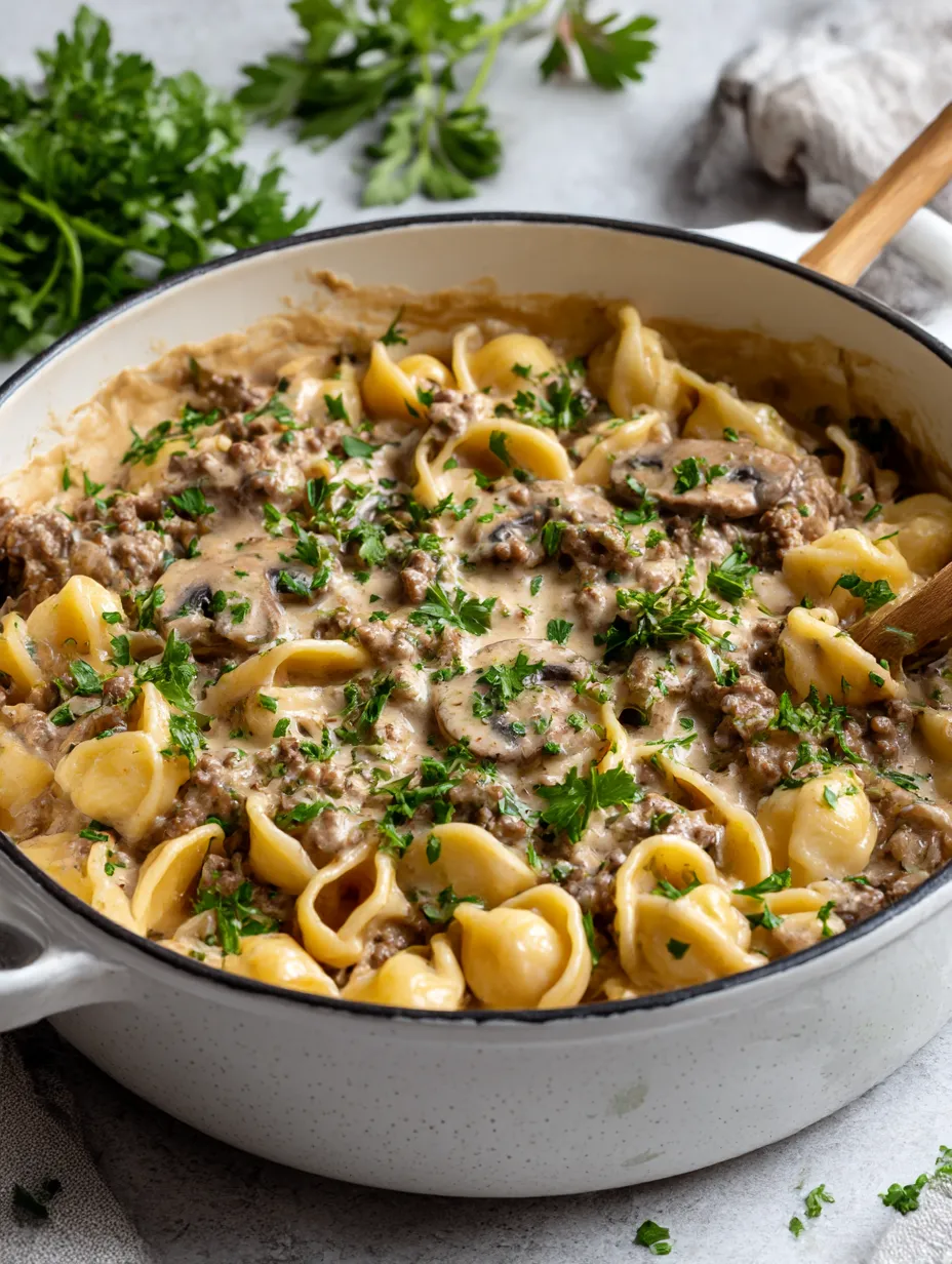 A bowl of food with the words "Easy Ground Beef Stroganoff" on it.